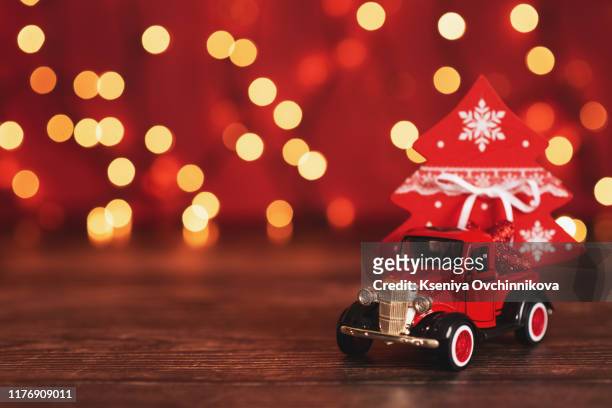 toy car with christmas tree - christmas truck stock pictures, royalty-free photos & images