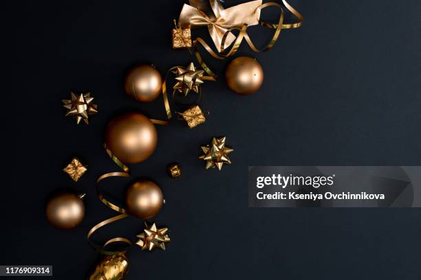 christmas, new year black stylish flat lay frame with gifts and a golden deer. top view. copy space - christmas background copy space stock pictures, royalty-free photos & images