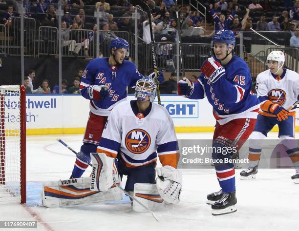 Brett Howden and Kaapo Kakko of the New York Rangers celebrate a second period goal by Vitali Kravtsov against Thomas Greiss of the New York...