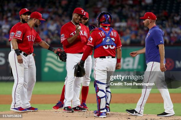 Manager Chris Woodward of the Texas Rangers pulls Edinson Volquez of the Texas Rangers from the game against the Boston Red Sox in the top of the...