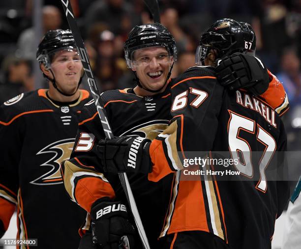 Jakob Silfverberg of the Anaheim Ducks celebrates his goal with Rickard Rakell and Isac Lundestrom to take a 2-0 lead over the San Jose Sharks during...