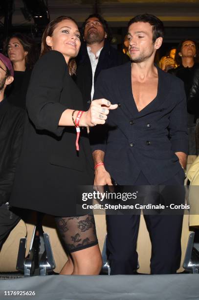 Caroline Receveur and her companion Hugo Philip attend the Etam Winter 2019/Summer 2020 show as part of Paris Fashion Week on September 24, 2019 in...