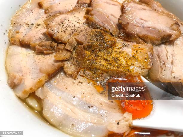 char siu pork on ramen noodles with pepper and chili oil condiments - char siu pork stock pictures, royalty-free photos & images
