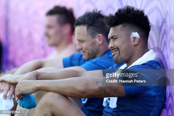 Richie Mo'unga, Ben Smith and Ardie Savea of the All Blacks relax following a New Zealand training session at Jissoji Ground on September 25, 2019 in...