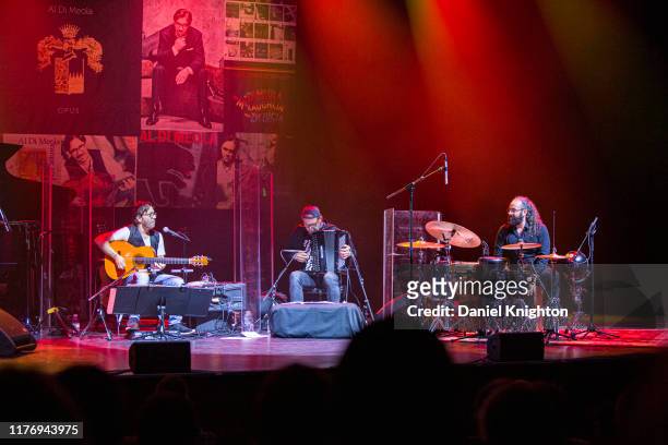 Musicians Al Di Meola, Fausto Beccalossi, and Sergio Martinez of Al Di Meola Acoustic Quartet perform on stage at The Magnolia on September 24, 2019...
