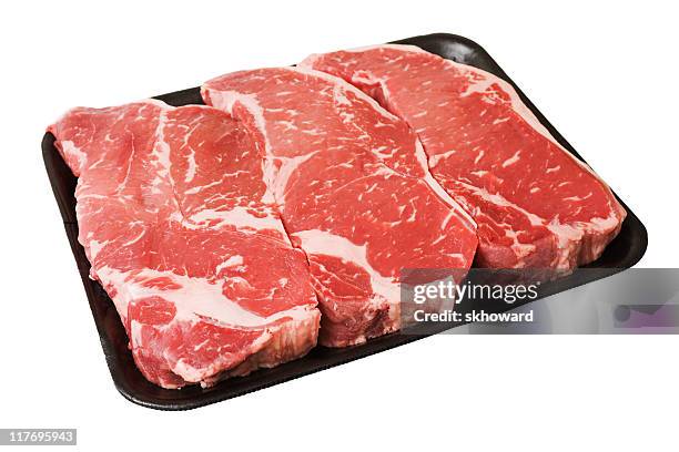 black styrofoam tray of raw boneless new york strip steaks - cut of meat stock pictures, royalty-free photos & images