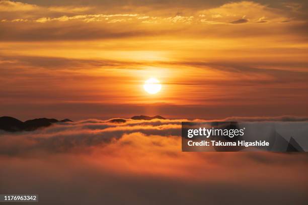 sunrise over the sea of clouds - sunrise ストックフォトと画像