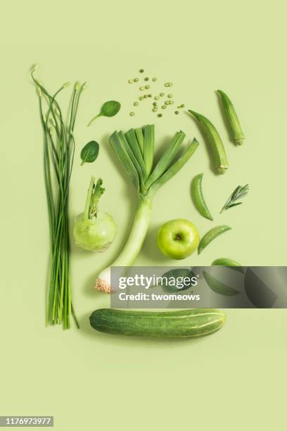 green vegetables and fruits still life. - green apple slices stock pictures, royalty-free photos & images