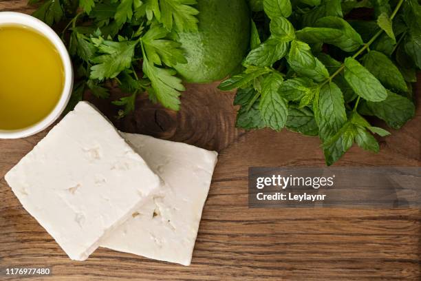 breakfast preparation
feta cheese, olive oil and slice bread on the wooden - feta stock pictures, royalty-free photos & images