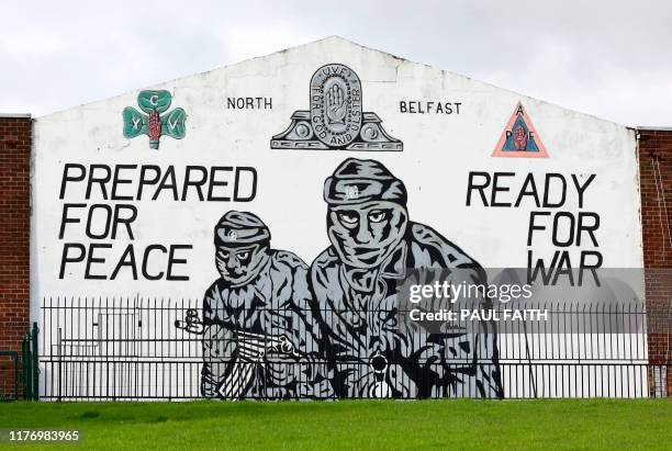 Photograph shows a Loyalist Ulster Volunteer Force mural in north Belfast on October 19, 2019. - British MPs voted Saturday to delay taking a...