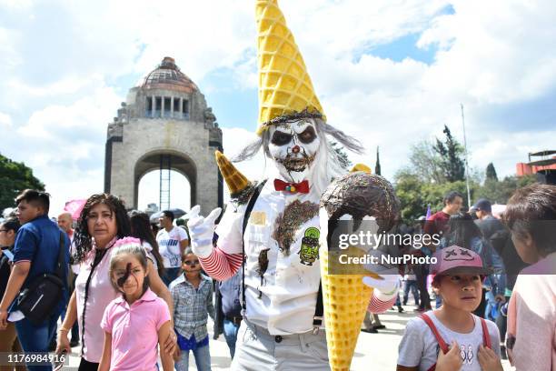 Participant disguised as clown is seen taking part during the march of annual Zombie Walk at Monumento of Revolucion on October 19, 2019 in Mexico...