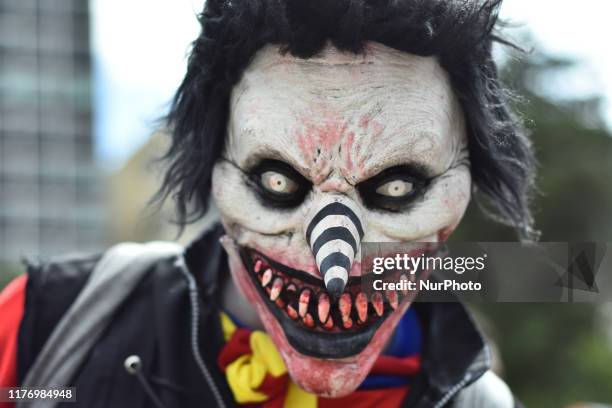 Participant disguised as clown is seen taking part during the march of annual Zombie Walk at Monumento of Revolucion on October 19, 2019 in Mexico...
