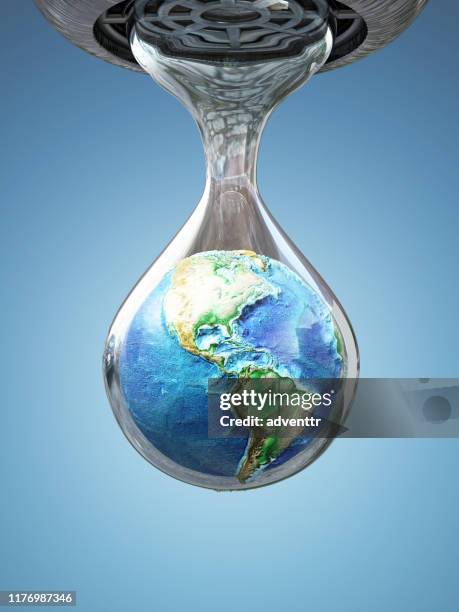 earth inside the dripping water drop - world economy stock pictures, royalty-free photos & images
