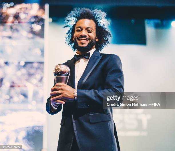 The FIFA FIFPro Men's World11 Award Winner Marcelo of Real Madrid and Brazil poses with his trophy during The Best FIFA Football Awards 2019 at...