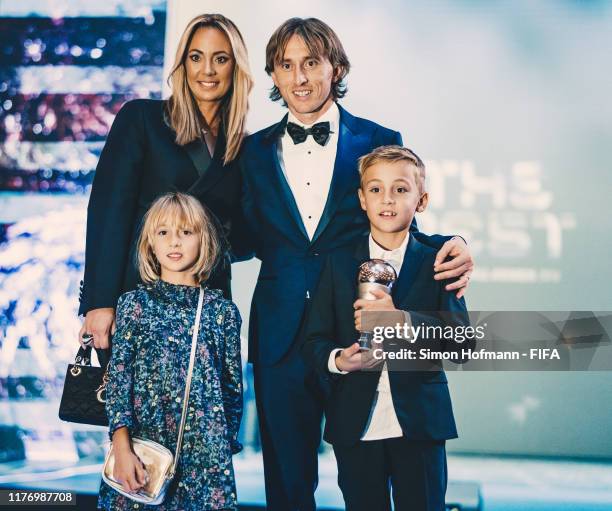 The FIFA FIFPro Men's World11 Award Winner Luka Modric of Real Madrid and Croatia, his wife Vanja Bosnic and their children Ivano and Ema pose for a...