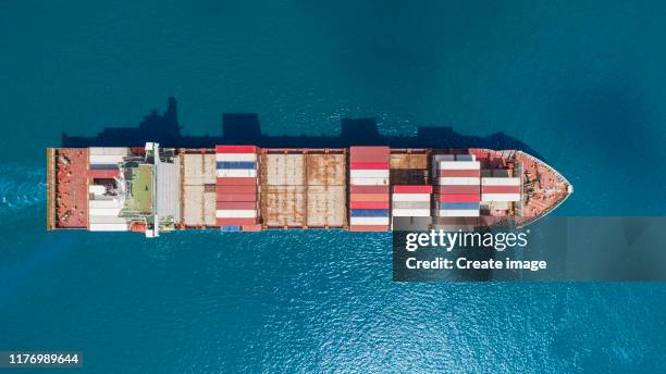 aerial top view container ship carrier container for logistics, import export, shipping or transportation. - shipping container top view - fotografias e filmes do acervo