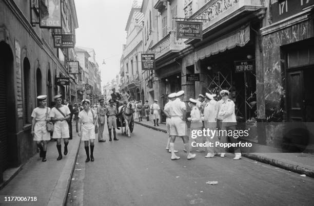 Royal Navy officers and naval ratings from the Mediterranean fleet enjoy leave in Gibraltar Town, Gibraltar during World War II in October 1940.