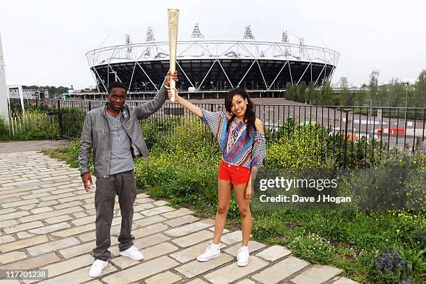 Tinchy Stryder and Dionne Bromfield pose with the official Olympic Relay Torch to announce they will be releasing the official Olympic torch relay...