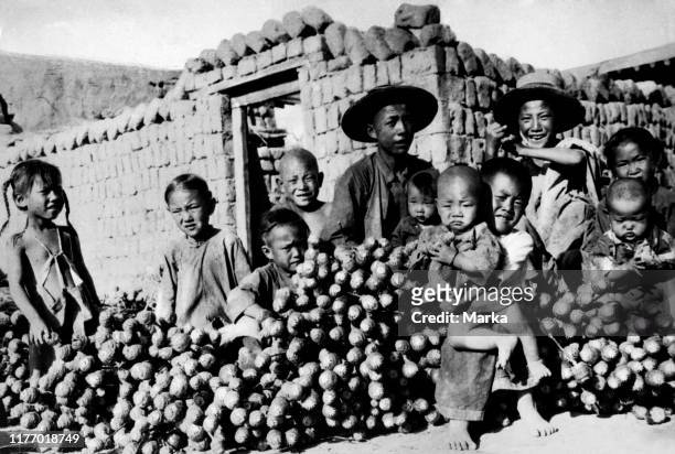 Children of Chinese farmers between harvests of opium. China. Asia. 1920-30.