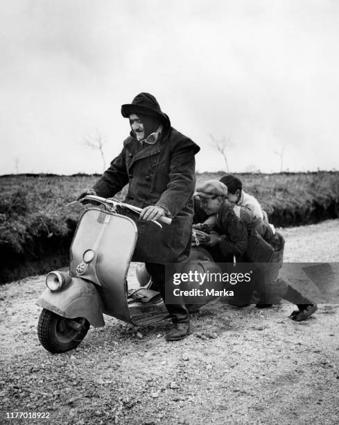 Man on scooter. 1952.