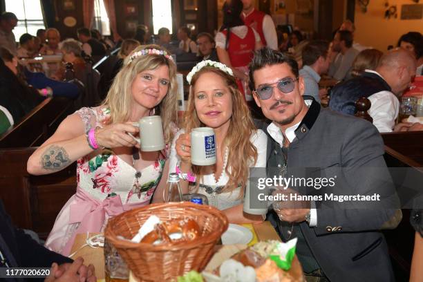 Chris Töpperwien, Doreen Dietel and Sandra Kiriasis during the 4th Charity Lunch "Frohes Herz e.V." as part of the Oktoberfest at "Zur Bratwurst" at...