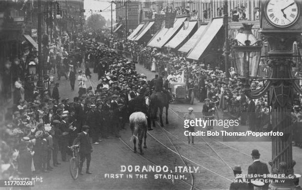Italian athlete Dorando Pietri passes through Harlesden in northwest London during the marathon event at the 1908 Summer Olympics in London, 24th...