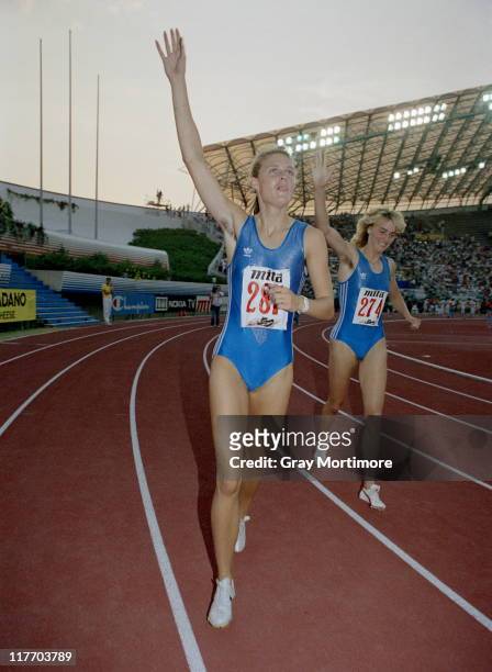 Katrin Krabbe of East Germany celebrates winning the Women's 200 metres with compatriot second placed Heike Drechsler at the 15th European Athletics...