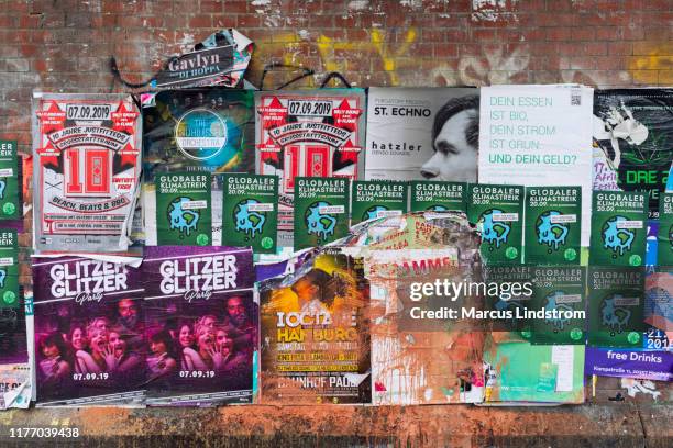 a wall with lots of posters - music festival poster stock pictures, royalty-free photos & images