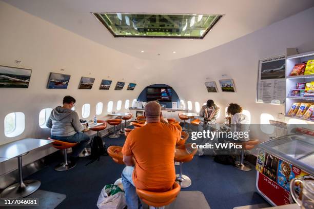 Stockholm, Arlanda, Sweden - The lounge area inside the Jumbo Stay , a hostel that is a converted Boeing 747 airliner. It is located at the entrance...