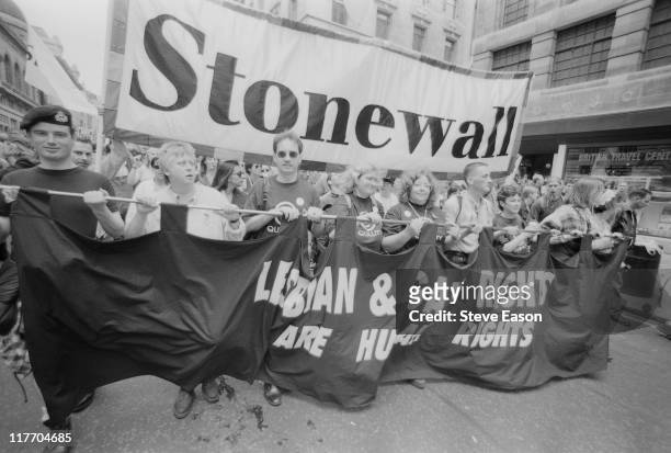 Protestors from lesbian, gay and bisexual rights charity Stonewall, carrying a banner reading 'Lesbian & Gay Rights are Human Rights' during the Gay...