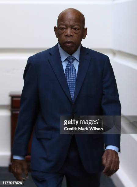 Rep. John Lewis walks to a meeting with the House Democratic caucus one day after House Speaker Nancy Pelosi announced that Democrats will start an...