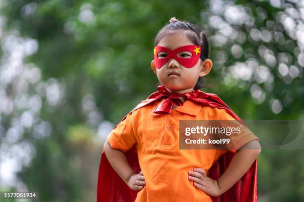 hero girl - superhero girl stock pictures, royalty-free photos & images