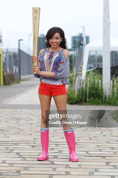 Dionne Bromfield poses with the official Olympic Relay Torch to announce she will be will be releasing the official Olympic torch relay song...