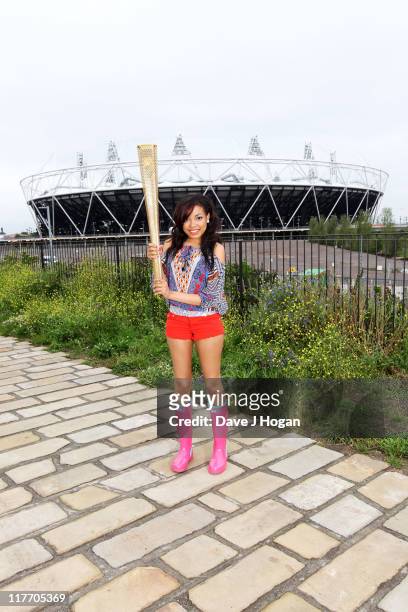 Dionne Bromfield poses with the official Olympic Relay Torch to announce she will be will be releasing the official Olympic torch relay song...
