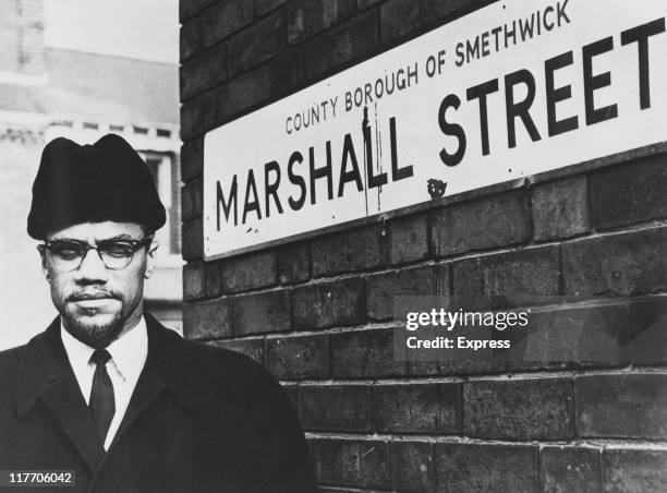 African-American Muslim minister and civil rights activist Malcolm X on Marshall Street in Smethwick, near Birmingham, 12th February 1965. The local...