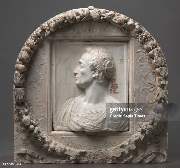 Julius Caesar, c. 1455-1460. Mino da Fiesole , garland by Mino da Fiesole and Workshop . Marble with traces of bole and limestone with traces of...