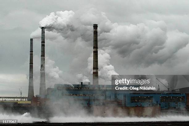 Smoke stacks for a nickel-refinery spew sulfur dioxide into the environment July 21, 2002 in Norilsk, Russia. The refinery releases some 2.8 million...