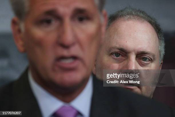 House Minority Leader Rep. Kevin McCarthy speaks as House Minority Whip Rep. Steve Scalise listens during a news conference at the U.S. Capitol...