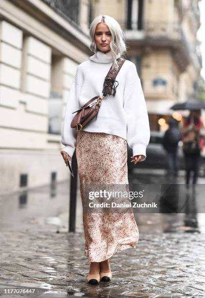 Victoria Magrath is seen wearing a cream sweater, pink skirt and brown purse outside the Lanvin show during Paris Fashion Week SS20 on September 25,...