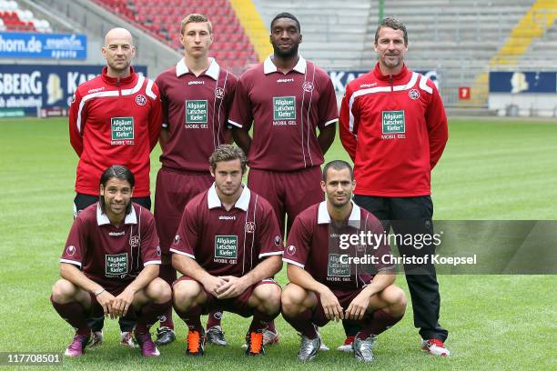 The new player of Kaiserslautern pose from from the upper row with assistant coach Guenter Gorenzel, Julian Derstoff, Richard Sukuta-Pasu and head...