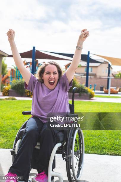 a young woman with disabilities in a wheelchair - developmental disability stock pictures, royalty-free photos & images
