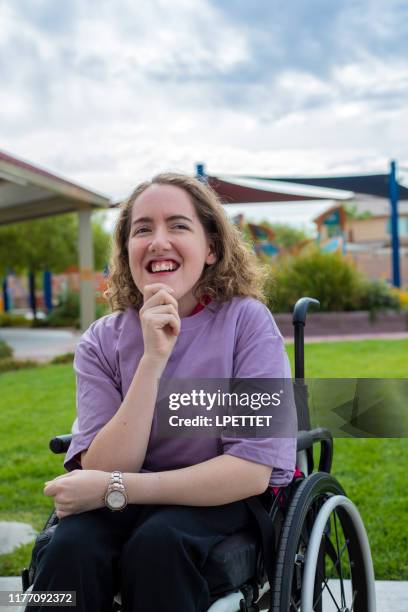 a young woman with disabilities in a wheelchair - cerebral palsy stock pictures, royalty-free photos & images