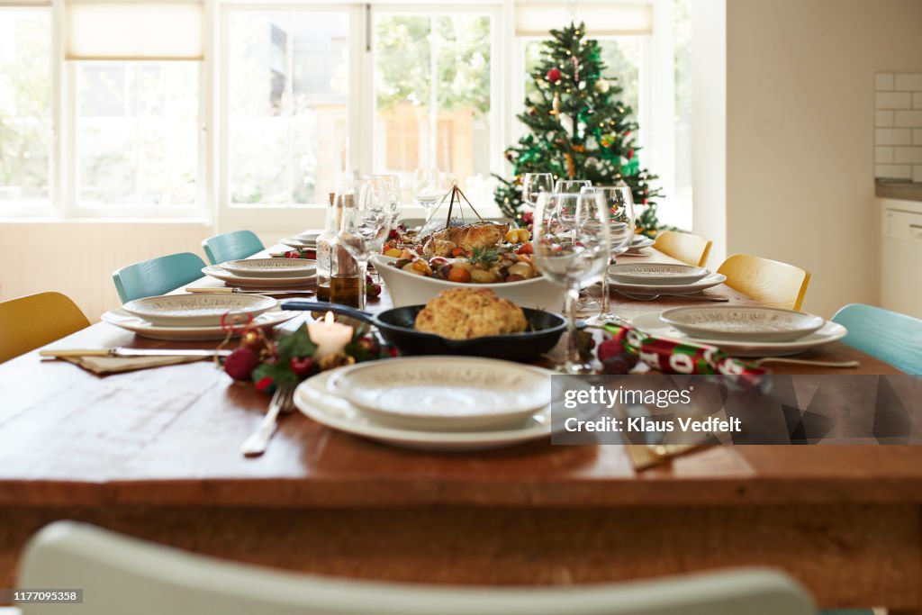 Meal with wine served on dining table at home
