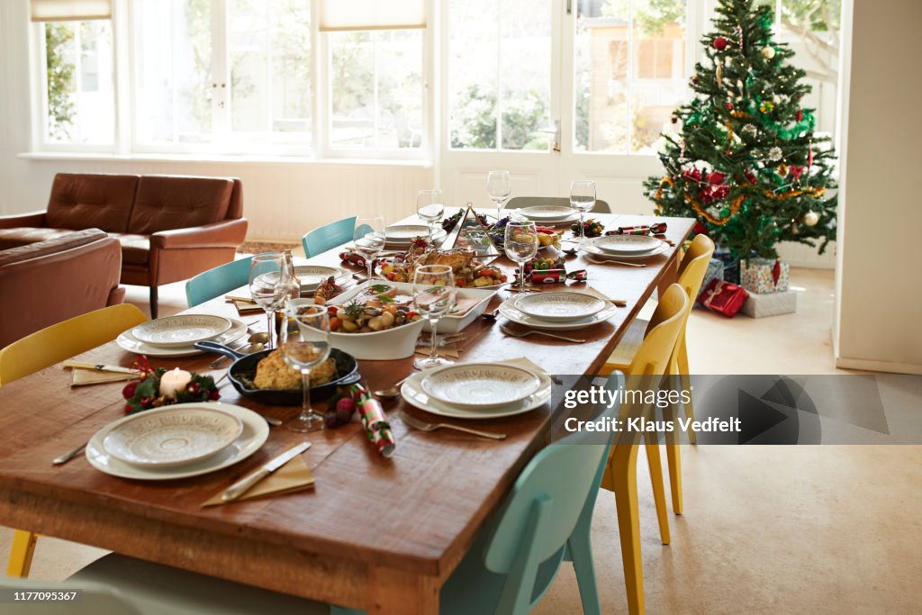 Food with wine served on dining table at home