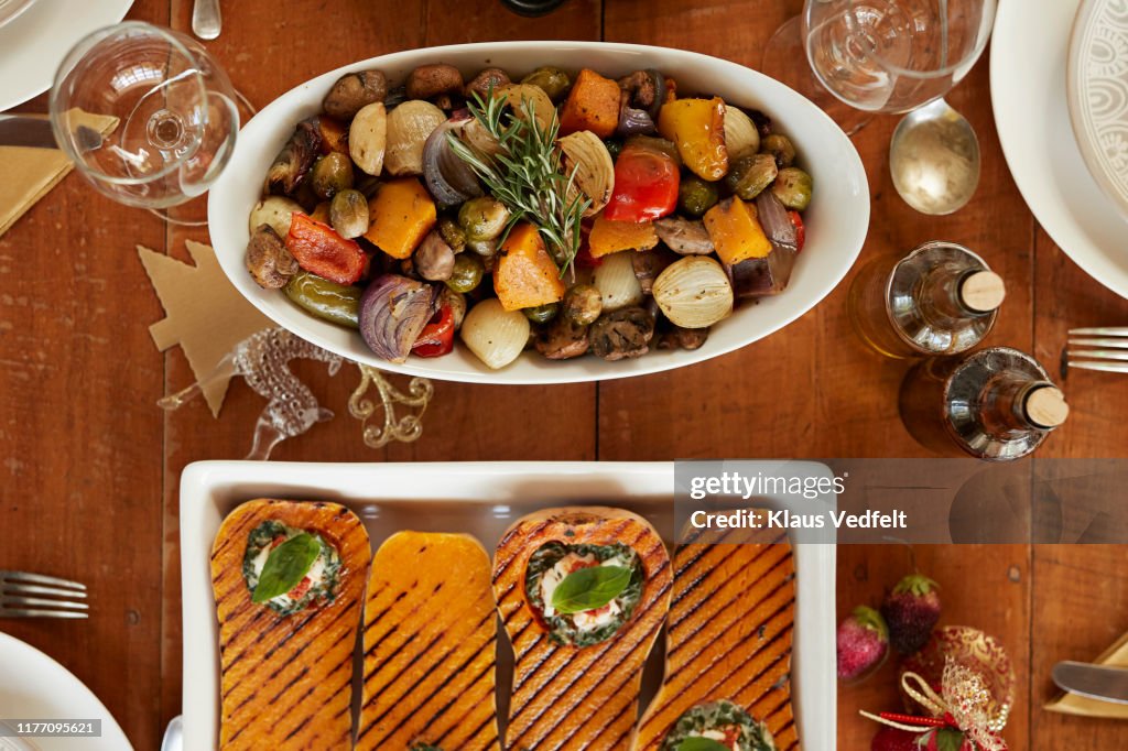 Appetizer and salad served in plates on table