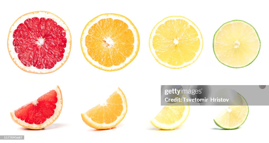 Mix of citrus fruit slices isolated on white background