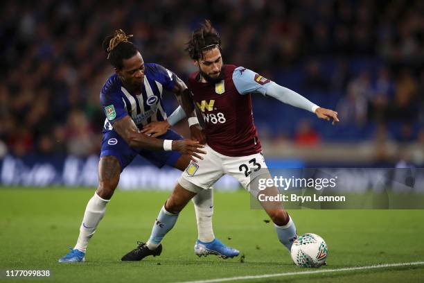 Gaetan Bong of Brighton & Hove Albion tackles Jota of Aston Villa during the Carabao Cup Third Round match between Brighton & Hove Albion and Aston...