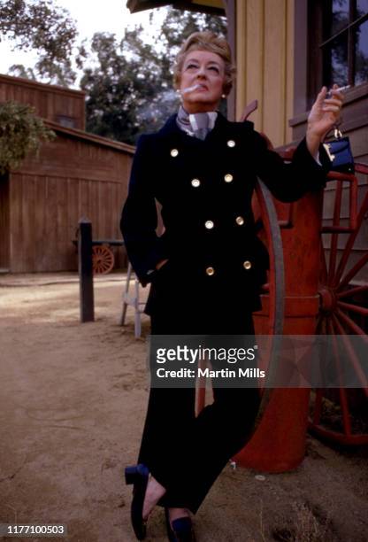 Actress Bette Davis poses on the set of the TV show 'It Takes a Thief' filming the third season episode 'Touch of Magic' circa November, 1969 that...
