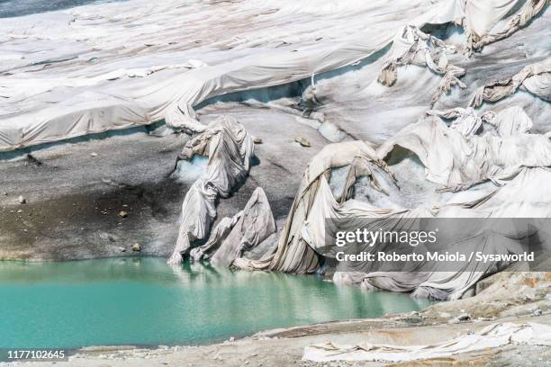 blankets protecting rhone glacier, valais, switzerland - gletscher stock-fotos und bilder