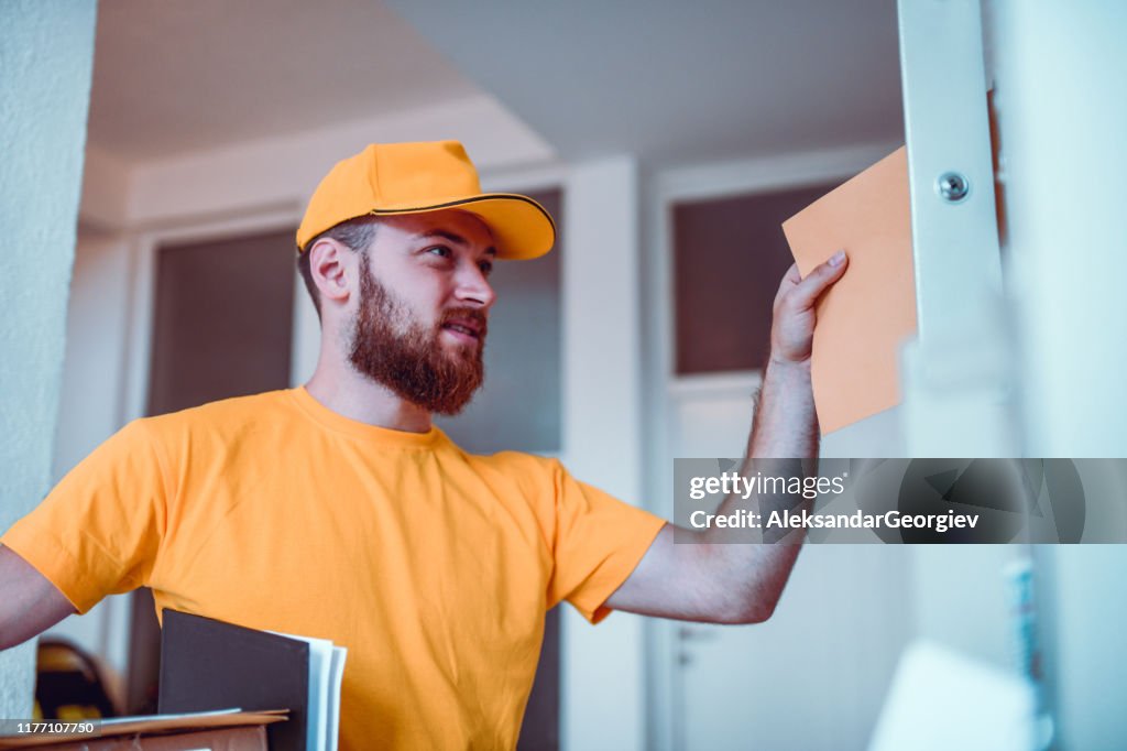 Postman Distributing Letters Happy Postman Delivering Letters High-Res Stock Photo - Getty Images